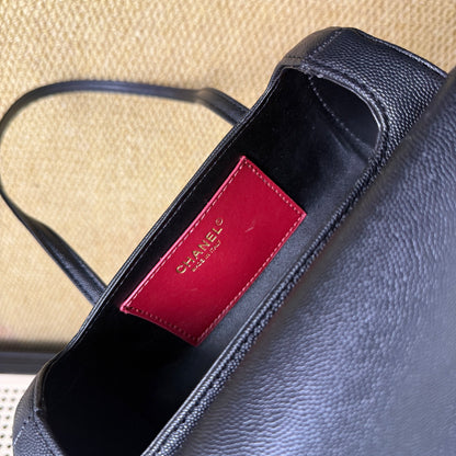 Black gold mini travel bag, cylindrical design, full view