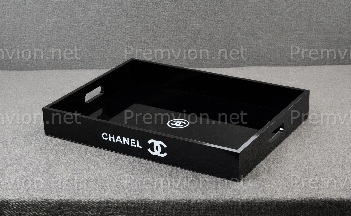 Elegant Chanel VIP gift black acrylic vanity organizer tray with glossy finish and side handles.