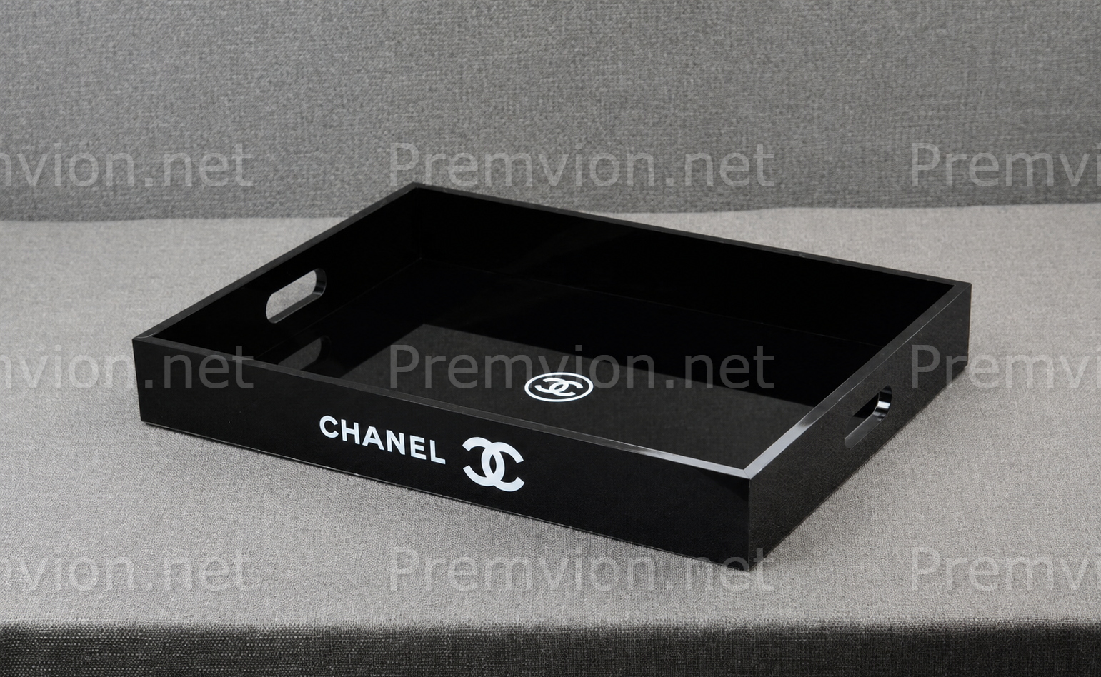 Elegant Chanel VIP gift black acrylic vanity organizer tray with glossy finish and side handles.