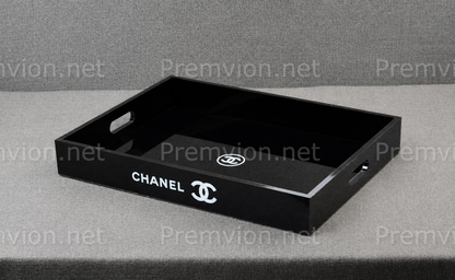 Elegant Chanel VIP gift black acrylic vanity organizer tray with glossy finish and side handles.