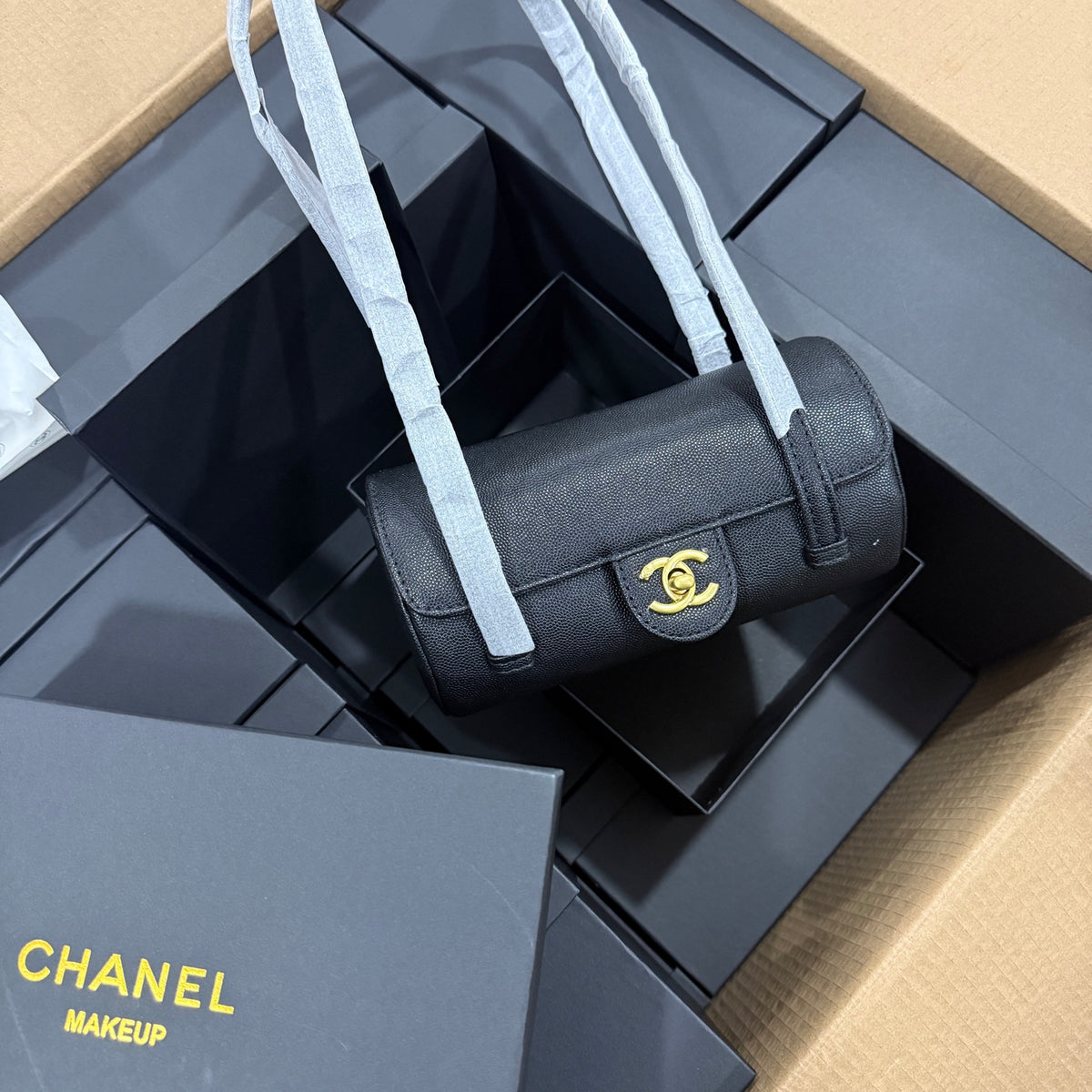 Luxury black gold cylindrical leather bag, top view