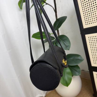Luxury cylindrical crossbody bag in black caviar leather