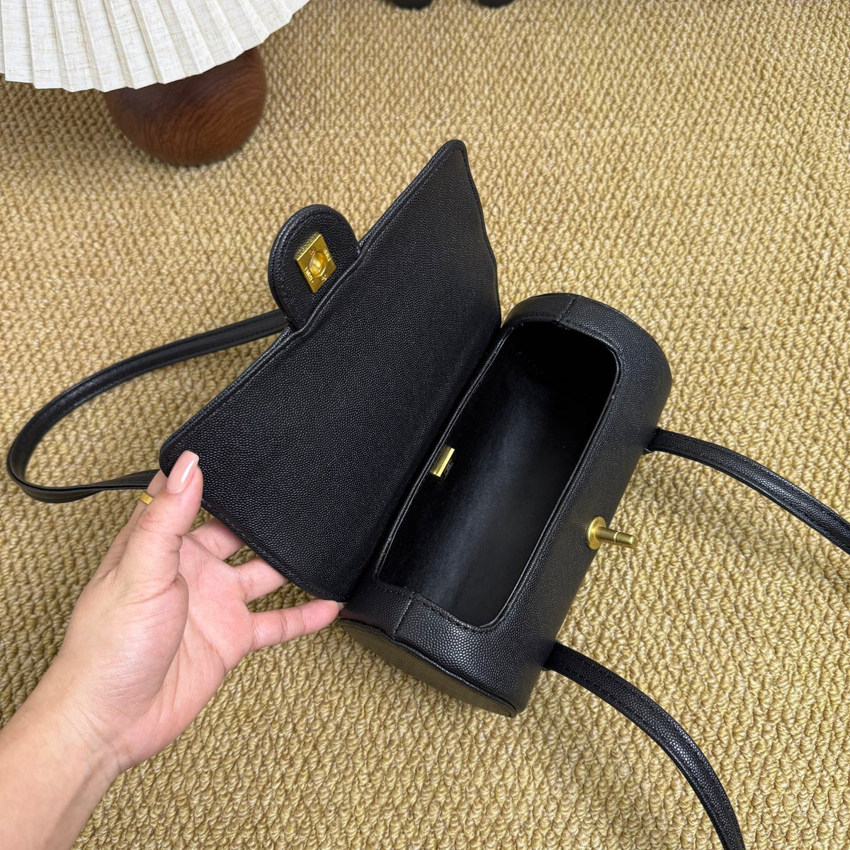 Luxury mini bowling bag in black caviar leather with gold hardware