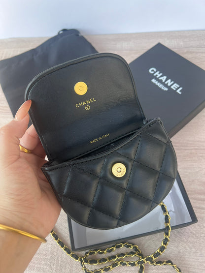 Pearl chain crossbody mini bag displayed at an angle