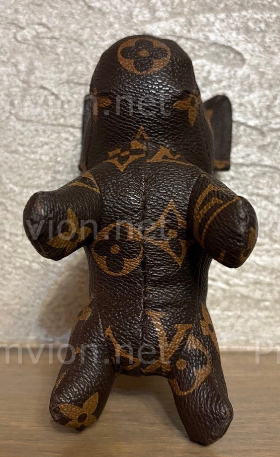 Full-body handmade French Bulldog figure crafted from upcycled Louis Vuitton leather.