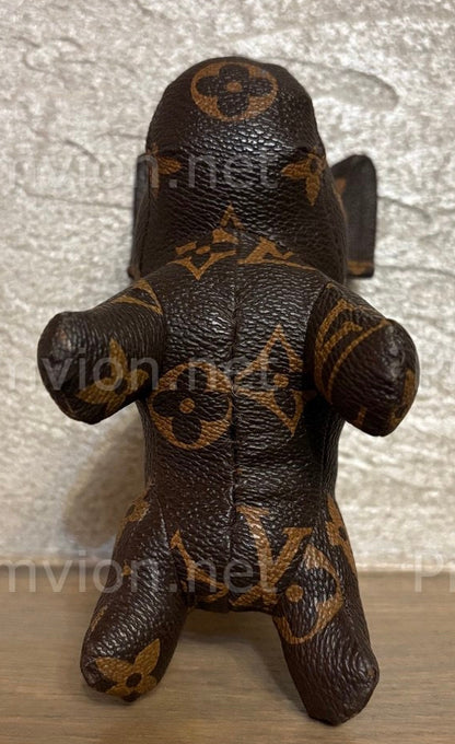 Full-body handmade French Bulldog figure crafted from upcycled Louis Vuitton leather.