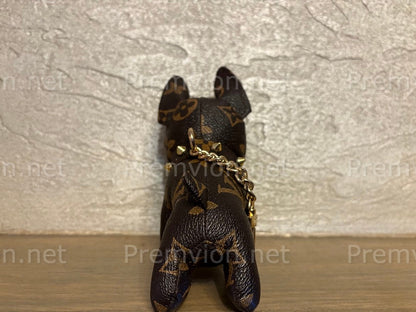 Recycled leather French Bulldog keychain displayed as a stylish bag charm, durable gold-tone clip, handmade sustainable accessory for fashion lovers