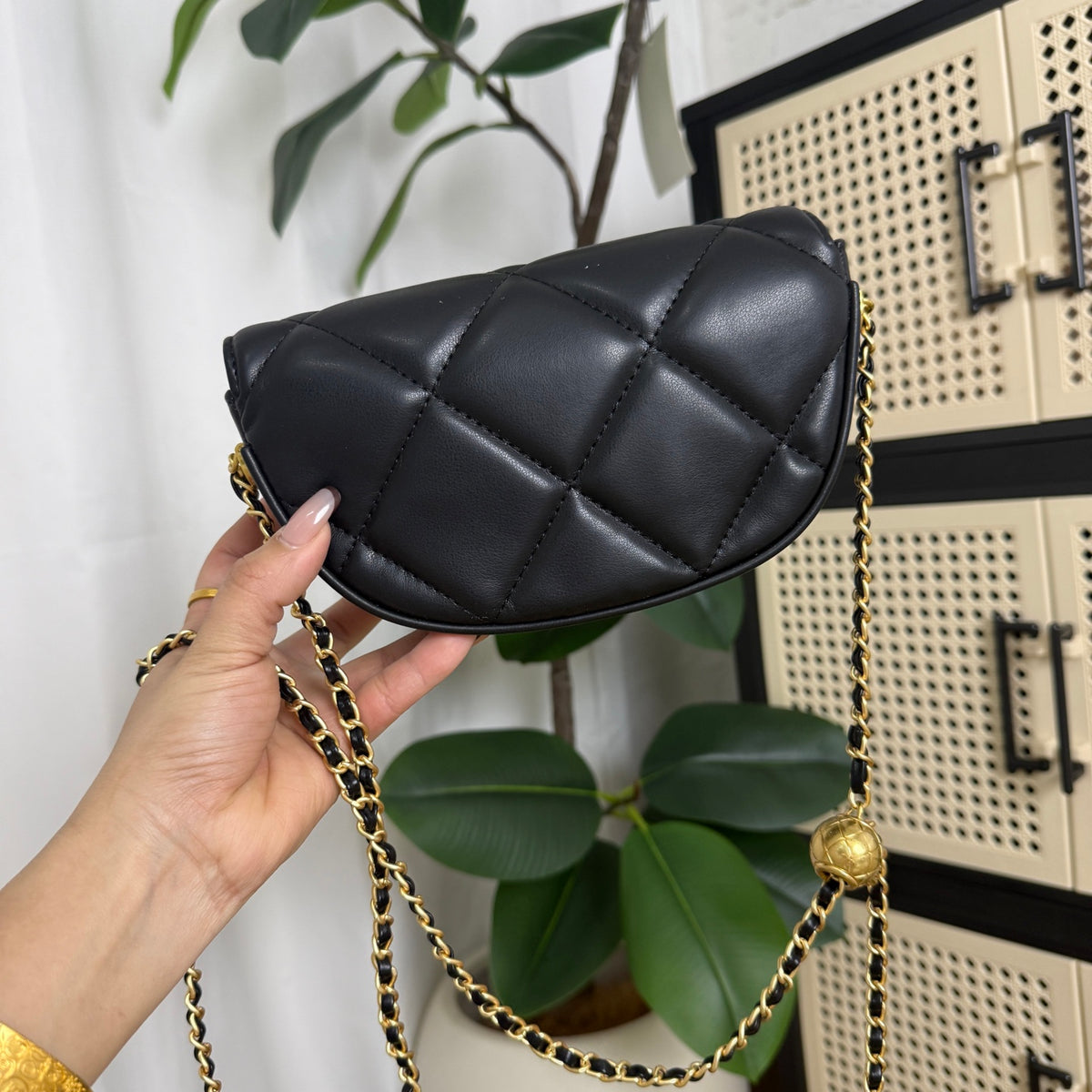 Luxury black gold crossbody bag with diamond quilting, full view