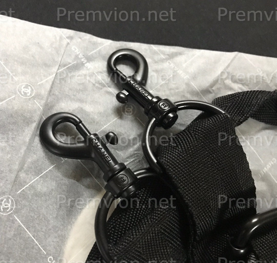 Chanel black luxury carry-on travel duffle bag spacious interior