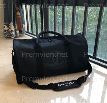 Chanel black designer weekend travel duffle bag with iconic CC logo
