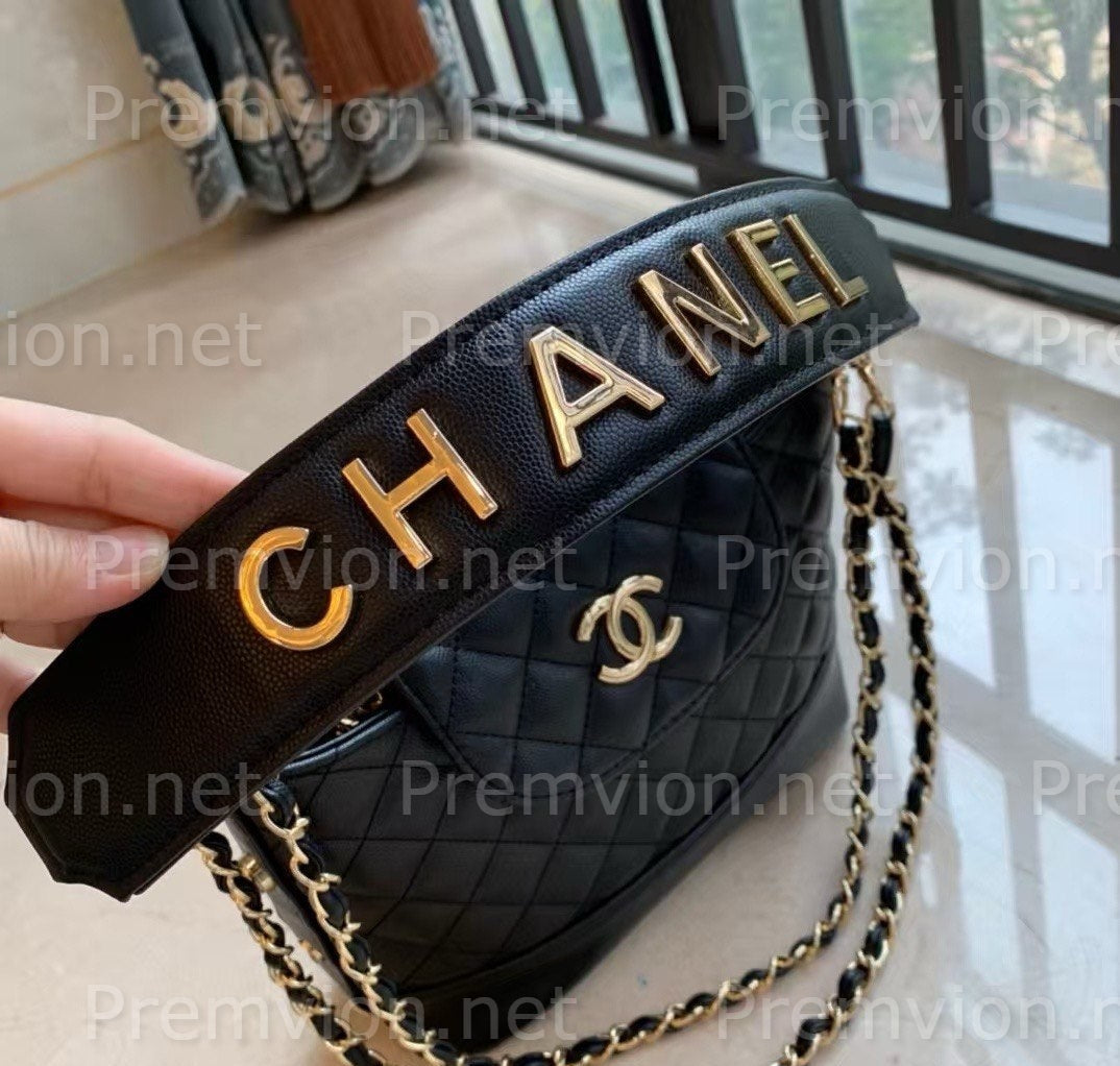 Black CHANEL Beauty promotional makeup bag with gold detailing