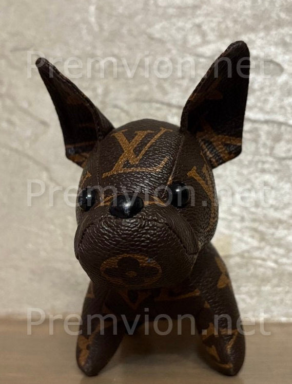Close-up of stitching and leather texture on handmade upcycled LV French Bulldog figure.