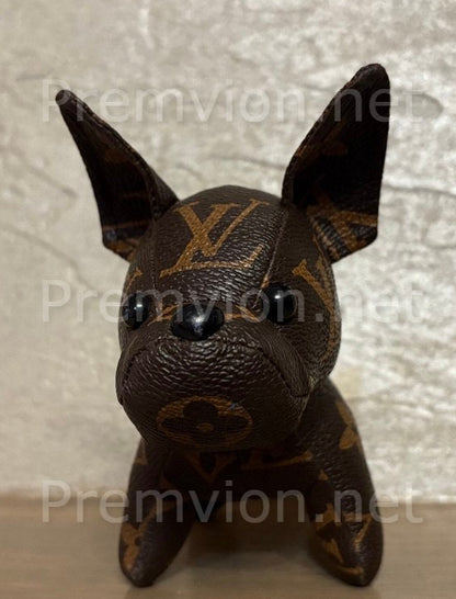 Close-up of stitching and leather texture on handmade upcycled LV French Bulldog figure.