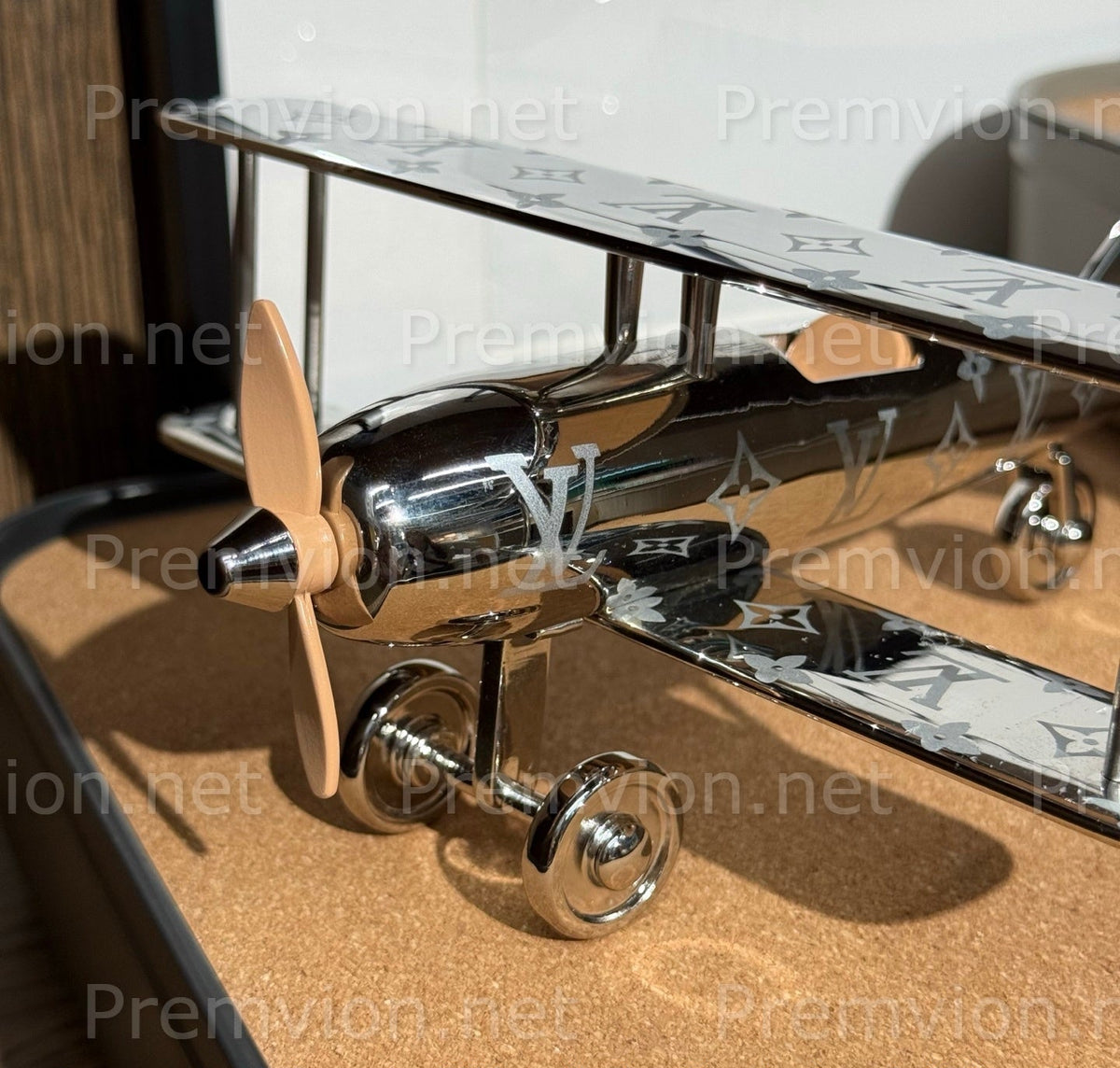 Louis Vuitton Monogram airplane collectible displayed on a desk