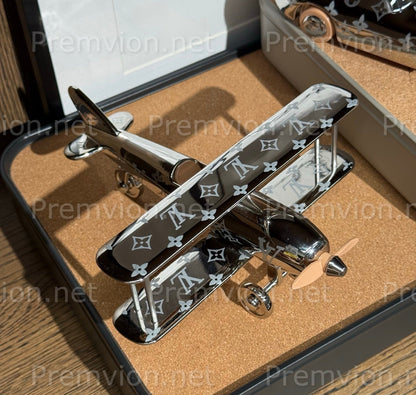 Louis Vuitton polished metal Monogram plane display with detailed aviation design