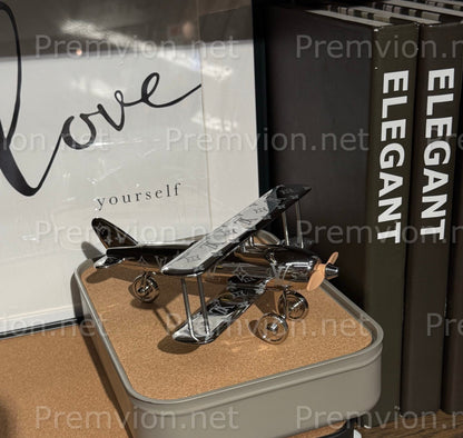 Louis Vuitton silver metal airplane with Monogram detailing