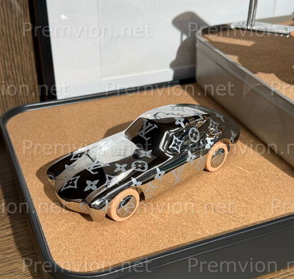 Louis Vuitton sports car decorative object with reflective metal finish