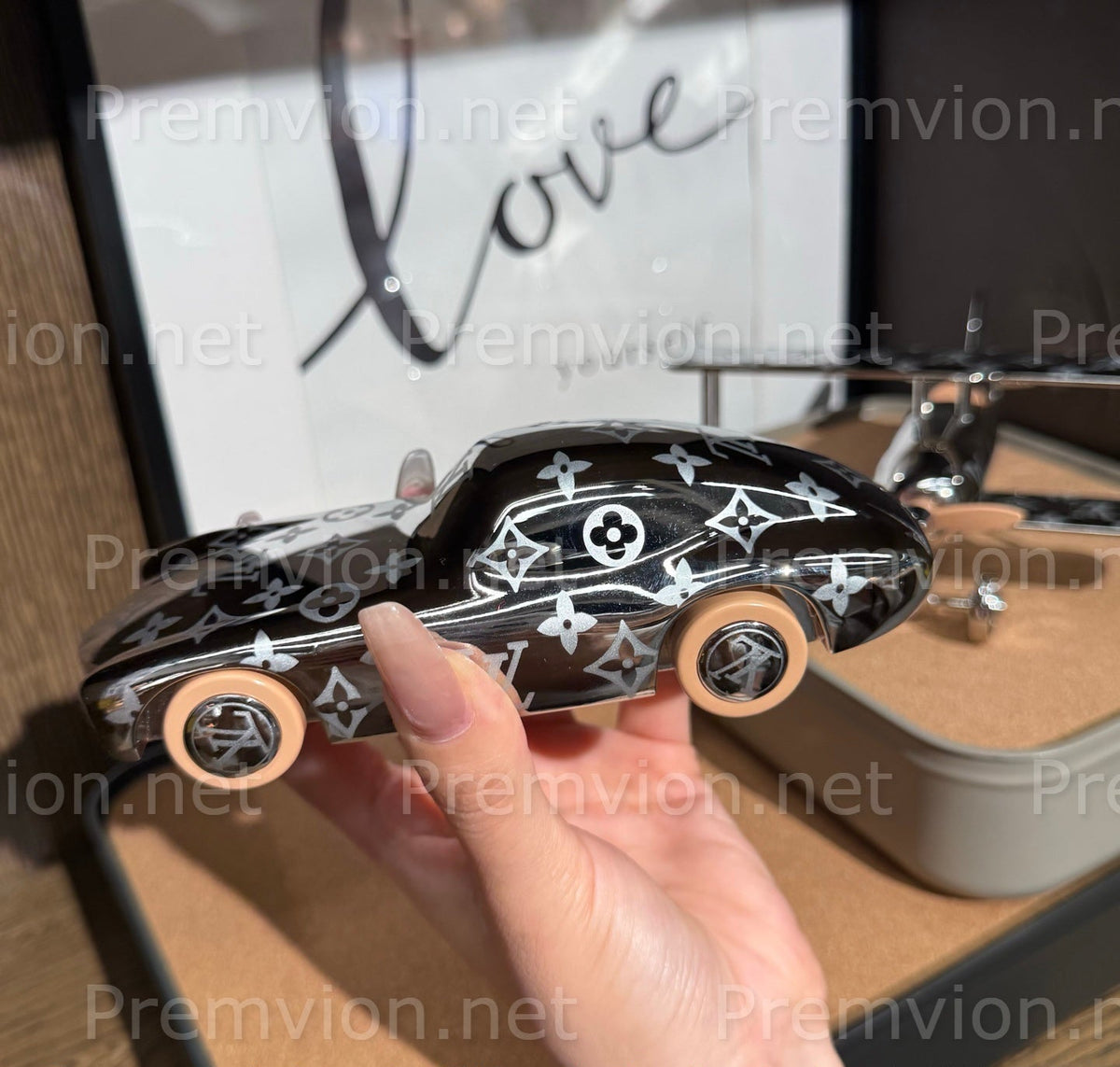 Louis Vuitton Monogram car collectible displayed as desk décor