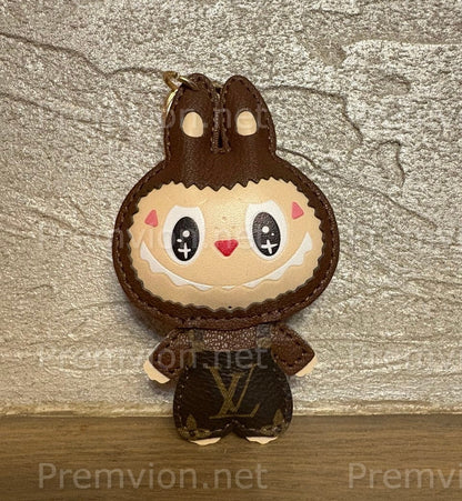 Louis Vuitton–style Labubu keychain featuring a monogram leather bunny character charm with stitched details, ideal for luxury bag decoration.