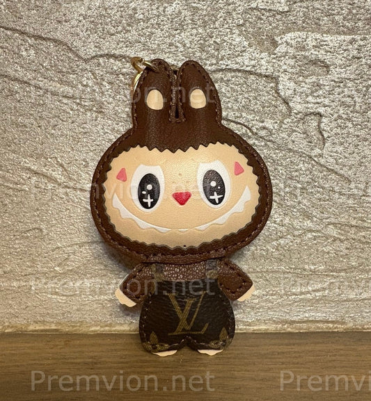 Louis Vuitton–style Labubu keychain featuring a monogram leather bunny character charm with stitched details, ideal for luxury bag decoration.