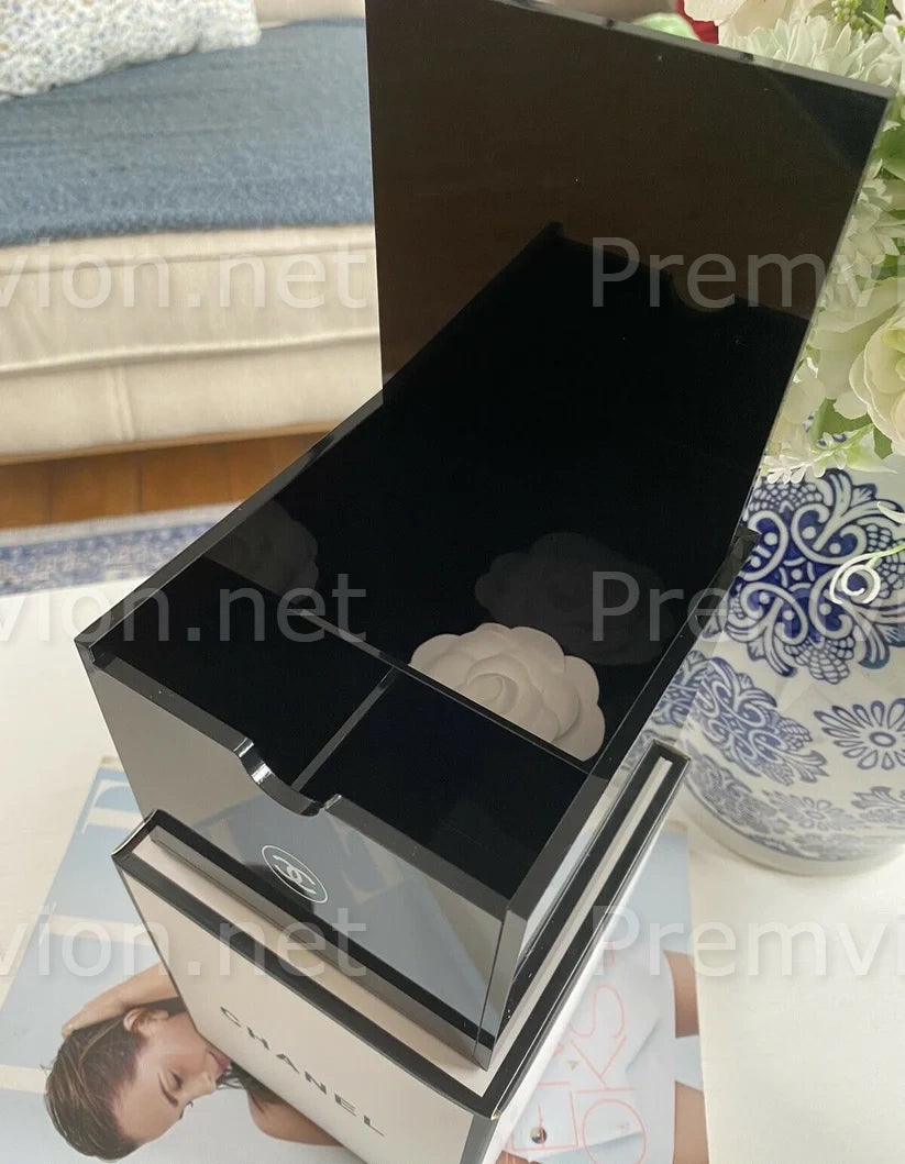 Luxury black Chanel acrylic organizer for cotton pads, cotton swabs, and skincare essentials.