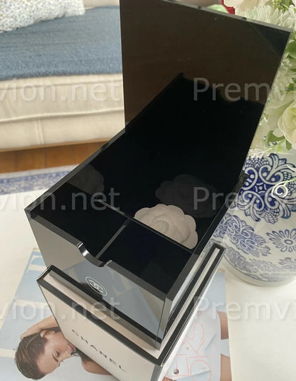 Luxury black Chanel acrylic organizer for cotton pads, cotton swabs, and skincare essentials.