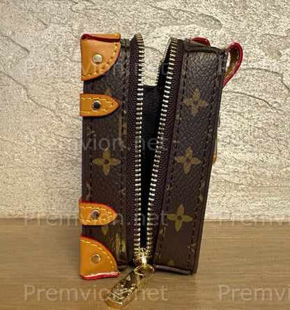 Luxury zippered keychain pouch crafted from LV monogram leather with premium detailing