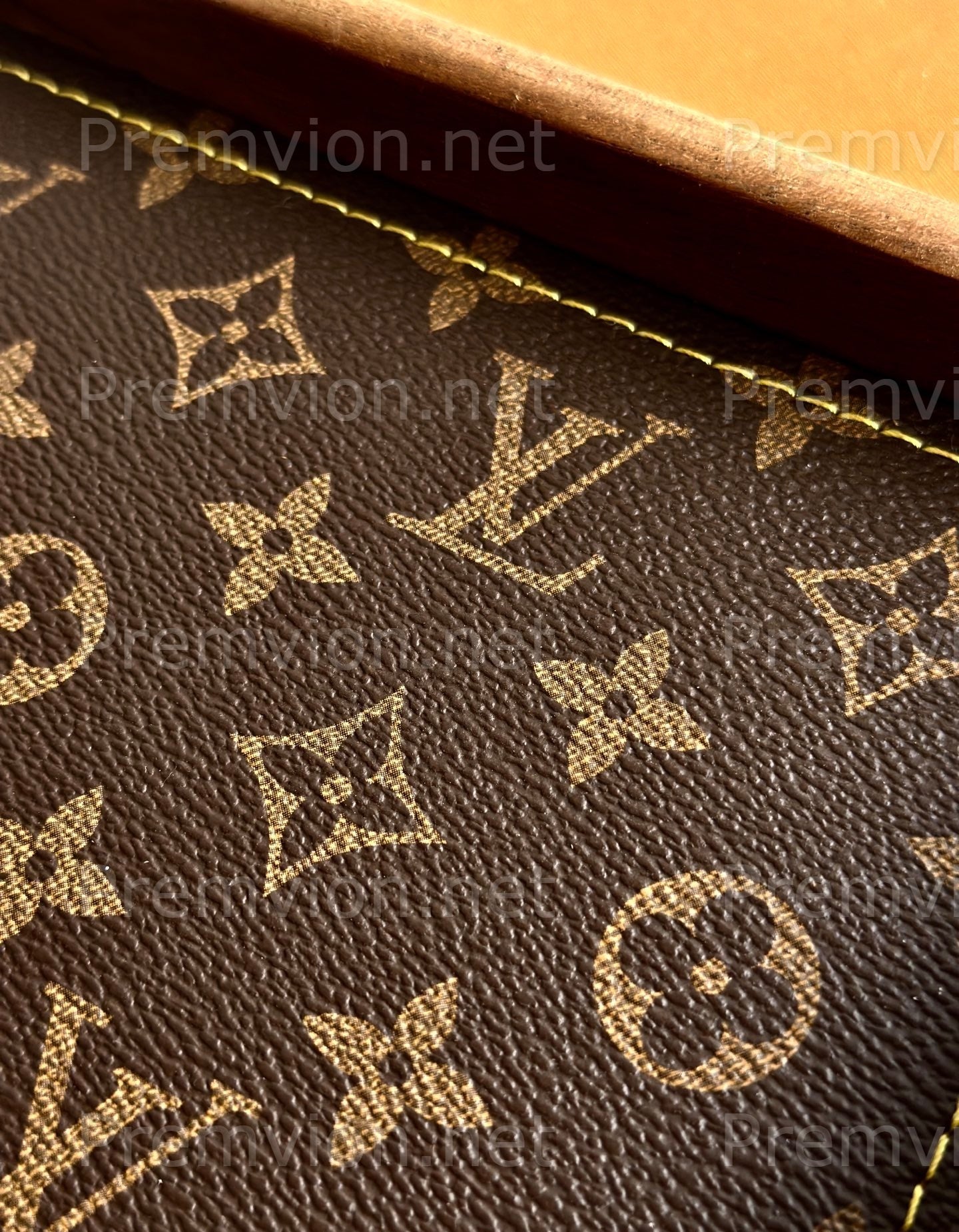 Close-up of premium LV monogram leather on handmade walnut wood tray