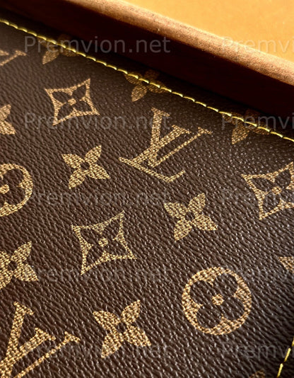 Close-up of premium LV monogram leather on handmade walnut wood tray