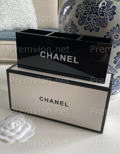 Chanel VIP gift black acrylic makeup organizer with three compartments for vanity storage and beauty essentials.