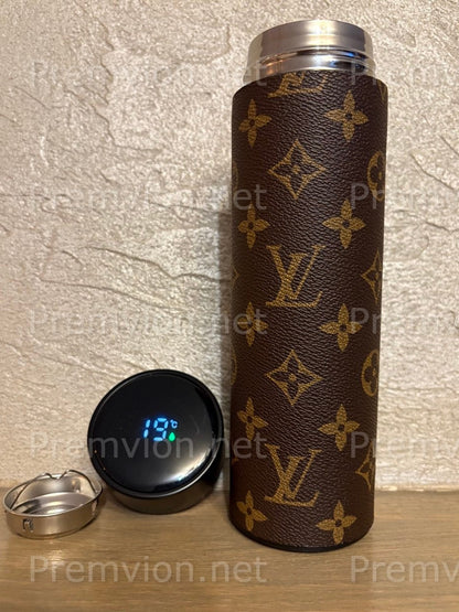 Elegant Louis Vuitton leather–style insulated travel mug with smart temperature display, perfect as a luxury gift item.